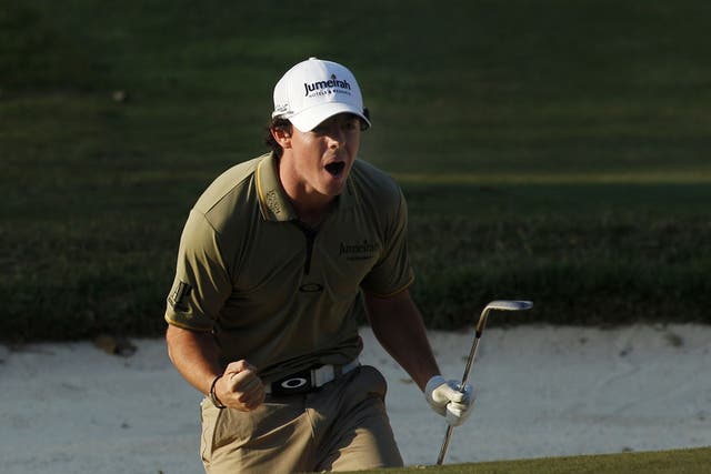 Rory McIlroy celebrates after his birdie on the 18th green
